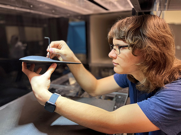 Student works with the Wind Tunnel